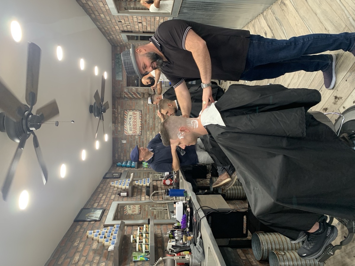Busy day at Bespoke Barber with multiple barbers cutting hair simultaneously